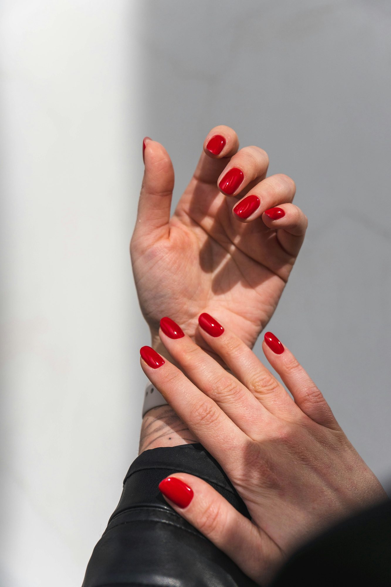Classic glossy red manicure close up