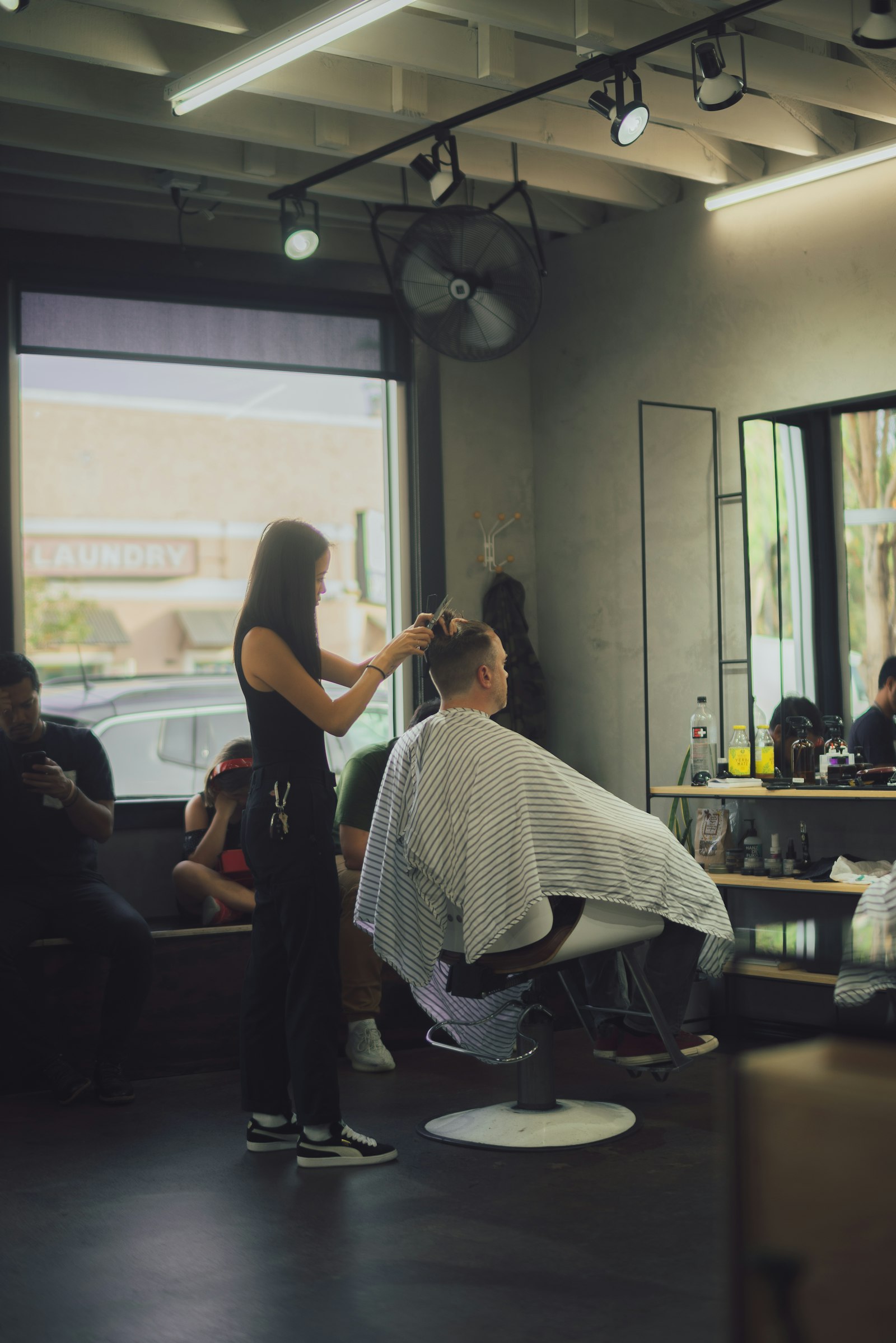Barber cutting a client's hair