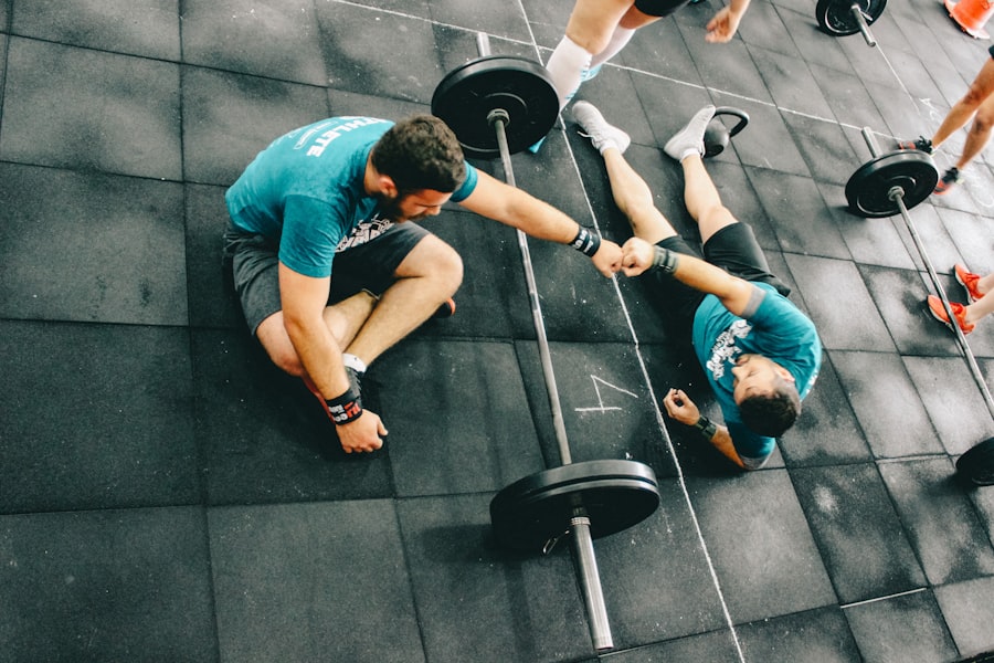Two members fist-bumping after finishing a coached session